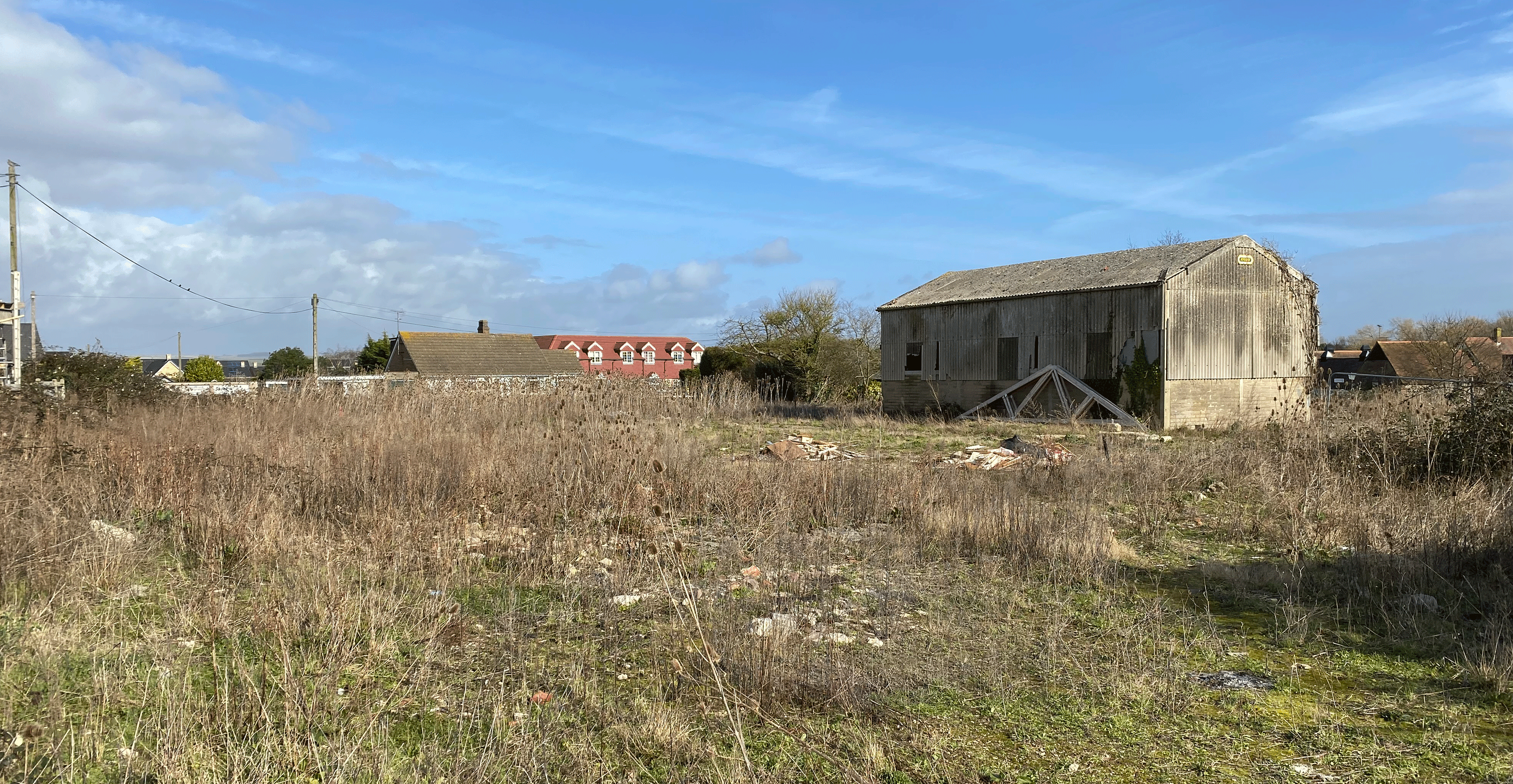 Existing site photo showing dilapidated barn